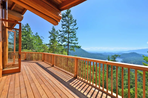 This home’s cedar deck overlooks a beautiful mountain range.